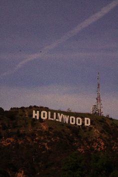 the hollywood sign is on top of a hill