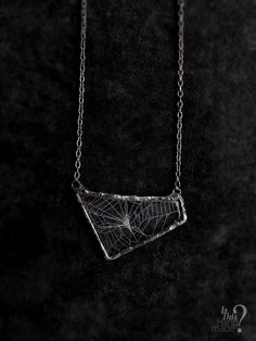 ( Spiderweb necklace, real cobweb resin, spiderweb pendant, caught in resin, triangle necklace, gothic necklace, captured in resin, spider web preserved, rustic goth pendant, statement necklace, golden ratio cobweb, spinnerets silk, rustic soldered ) This is real spiderweb pendant. It's completely handmade, in three dimensional triangle-ish shape pendant, on long gunmetal chain. Pendant is transparent and spiderweb looks the best on black clothes, it's very vibrant and made with love although is stolen from a spider (but spider wasn't harmed nor were other insects). Pendant is made with high quality non-yellowing resin and lead free tin. You will recieve exact product as it's in the picture.  Dimensions of pendant are: 6,5 cm x 4 cm Necklace length (chain + pendant, height from top to bott Spiderweb Necklace, Resin Triangle, Clay Necklace Pendant, Spider Web Necklace, Goth Pendant, Real Spiders, Soldered Pendants, Spider Necklace, Gothic Pendant