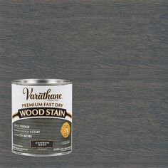 a can of wood stain sitting on top of a table