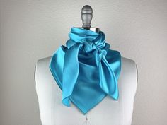 Beautiful handmade silk scarf. Pair this beauty with your favorite CR RanchWear shirt for a classy show look. 100% Imported Silk Size: 36x36 inches Made in Dallas, Texas Blue Satin Silk Scarf As Gift, Blue Satin Silk Scarf For Gift, Elegant Silk Scarf With Satin Finish For Summer, Formal Satin Scarves With Satin Finish, Elegant Satin Finish Silk Scarf For Summer, Elegant Blue Scarves For Wedding, Elegant Blue Scarf For Wedding, Classic Satin Scarves As Gift, Elegant Blue Scarves For Party