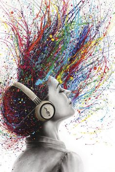 a woman's head with colorful splattered hair and headphones on it