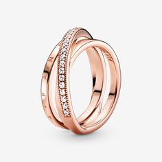 Triple your style with the Crossover Pavé Triple Band Ring. This classic yet modern 14k rose gold-plated ring boasts three interconnected bands. The top band features clear cubic zirconia pavé and overlaps over the other two bands, one of which is embossed with the Pandora logo, while the other is polished. Elegant and glamorous, once you put this stunning crossover ring on, you won't want to take it off. - Pandora Crossover Pavé Triple Band Ring - 14k Rose gold-plated unique metal blend / Cubic Pandora Logo, Triple Band Ring, Pandora Rose, Rose Gold Plated Ring, Crossover Ring, Pandora Rings, Pave Ring, Matching Rings, Gold Plated Rings