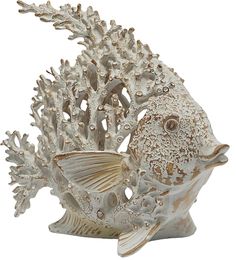 a white ceramic fish with corals on it's back