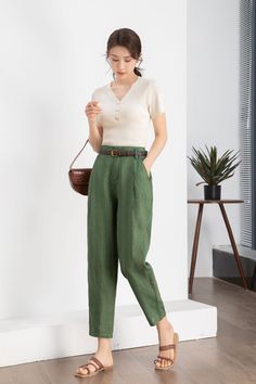 "Looking for a stylish addition to your summer wardrobe? Look no further than these Green Striped Linen Tapered Pants, available for sale on ETSY. Made from high-quality linen fabric, these pants are both comfortable and breathable, perfect for warmer weather. Featuring a trendy green stripe design and a flattering tapered fit, they're sure to turn heads wherever you go. DETAIL * 100% linen * Two side pockets * Front button and zipper closure * Tapered pants * High waisted Pants * Has belt loops to keep everything in place * Perfect for summer, autumn and spring * Wash by hand or machine with cold water * The belt model wears is not for sale Mode size Waist 26\"(66cm) Heigth 5'7\"(167cm) She wears the size XS Choose CUSTOM Order if you * Need a better fit * Can't find your size in our size Green Linen Wide Leg Pants For Work, Green Linen Ankle-length Pants, Green Ankle-length Linen Pants, Summer Workwear Green Harem Pants, Spring Green Straight Leg Harem Pants, Green Harem Pants For Workwear In Summer, Green Summer Harem Pants For Workwear, Summer Green Harem Pants For Work, Summer Green Linen Harem Pants