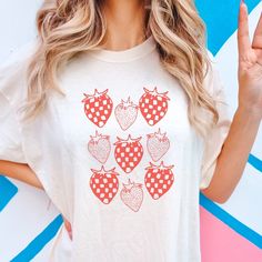 Embrace the berry trend with this artsy skater aesthetic checkered strawberry print t-shirt. Cute and casual when it's oversized for teens and trendy young moms (or trendy old moms. we don't discriminate) Printed on a TOP QUALITY Comfort Colors Tshirt Direct to Garment Printed, not a transfer 80% ringspun cotton 20% polyester Gets softer each time you wear it Sure to be your new favorite shirt! Produced and delivered in about a week with tracking provided upon shipment I accept returns/exchanges Cotton Short Sleeve T-shirt With Strawberry Print, Cotton T-shirt With Strawberry Print, Fun Strawberry Print Crew Neck T-shirt, White T-shirt With Fruit Design For Spring, Retro Cherry Print T-shirt For Summer, Trendy Summer Tops With Cherry Print, Casual White Tops With Fruit Print, Trendy Spring Tops With Strawberry Print, White Casual Fruit Print Top