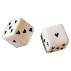 two white dices with black hearts on them