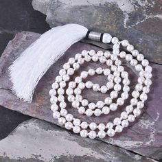 "📿 Wearer of Moti Mala/Pearl Mala can get the blessings of moon, as Moti/Pearl is the gemstone of moon. This rosary is used in saatvik works or for completion of something. Those who are short tempered can wear this rosary as a necklace as it will make you calm. One who wears Moti (Pearl) Mala enjoys good fortune and is blessed by the Maa Laxmi (the goddess of wealth), he becomes sinless, and obtains energy and intelligence. He achieves a high position by his knowledge and becomes renowned. 📿 Spiritual Round Beads Pearl Pendant Jewelry, Spiritual Pearl Necklace With Round Beads, Spiritual Necklace With Pearl Pendant And Round Beads, Spiritual Pearl Pendant Necklace, Spiritual Pearl Chain Jewelry With Round Beads, Elegant 8mm Beads Jewelry For Blessing, Spiritual Pearl White Jewelry For Gifts, Spiritual Pearl Drop Necklace, Spiritual Pearl Drop Necklace In Pearl White