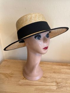 "This Milan wheat straw 3.5-inch brim boater hat has a 2\" black grosgrain ribbon band with black ribbon edges. This hat will fit up to a 22 5/8 inch head size and has a cord inside the band to adjust to your head size. NOTE: Please check the head size before purchase, I am happy to answer any questions you may have. There will be a 20% restocking fee for all returned hats." Classic Black Straw Fedora, Kentucky Derby Black Brimmed Boater Hat, Black Brimmed Boater Hat For Kentucky Derby, Black Straw Fedora With Flat Brim, Classic Black Straw Hat, Black Straw Visor Hat, Adjustable Black Wide Brim Boater Hat, Black Straw Panama Hat With Flat Brim, Black Adjustable Boater Hat With Short Brim