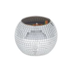 a silver disco ball shaped vase sitting on top of a table