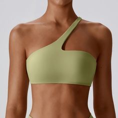 Enhance Your Workout with Style and Comfort Step up your fitness game with our Women's One-Shoulder Sports Bra, designed to offer both high performance and trendy aesthetics. This versatile piece is perfect for any activity, from intense gym sessions to peaceful yoga stretches. With its unique one-shoulder design, you'll stand out while staying comfortable and supported. Ideal for all seasons, it's the only sports bra you'll need year-round. Product Features Made from a premium blend of nylon and spandex, this sports bra promises durability and stretch, accommodating every move you make. The breathable fabric ensures cool and dry workouts, no matter the intensity. Its push-up feature enhances your shape, providing confidence along with comfort. Whether you're running, cycling, or engaging Extreme Activities, Fitness Top, Workout Games, Yoga Stretches, Fitness Activities, Yoga Session, Shoulder Design, Athletic Wear, Workout Wear