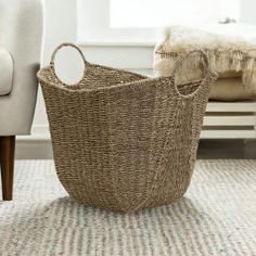 a basket sitting on the floor next to a chair