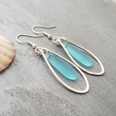 "Aloha! These design shows my love for this beautiful island of Hawaii. This item will be made to order and shipped directly from Hawaii. This is sea glass earrings with silver hooks. This handmade in Hawaii jewelry gift is from cultured sea glass that are specially formed into its shape for jewelry making. Each comes with a gift box with \"handmade by yinahawaii\" stamp and a ribbon wrapped as shown in the 2nd photo, ready to give as gift. I also offer Free gift messaging with the order. Please Blue Sea Glass Necklace, Beach Glass Necklace, Hawaii Jewelry, December Birthstone Jewelry, Hawaiian Jewelry, Sea Glass Earrings, Blue Sea Glass, Sea Glass Necklace, 925 Sterling Silver Chain