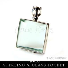 a small square glass bottle with the name sterling & glass locket on it's side