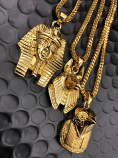 KING TUT Gold Chain -28" Franco Chain ANPU / ANUBIS Gold Chain -26" Franco Chain HERU / HORUS Gold Plated Chain -22" Franco Chain - Each pendant comes with a 18k PVD gold plated 2.5mm franco style chain 100% Money-Back Guarantee, if unsatisfied with product, simply send it back within 7 days for a full refund or exchange. - Won't discolor skin or crack- Gold Plating has a 2yr guarantee - Order Now to receive your package within 3-7 Business Days for domestic orders, & 10-14 business days for int Anubis And Horus, Mens Diamond Stud Earrings, 3 Kings, Ancient Egyptian Jewelry, Luxury Gifts For Men, Black Unicorn, King Tut, Egyptian Jewelry, Gold Accessories