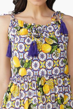 Printed viscose Maxi-length tiered dress Shoulder straps with tassel detailing Frill at neckline Tiers highlighted with baby overlock Squeeze the most out of summer with the Citrus Lemon Maxi Dress - a refreshing and radiant dress for statement-making summer style.This dress is the most scrumptious slice of summer style with its gorgeously feminine full-length silhouette. Featuring a vibrant lemon print on 100% viscose fabric that's as flowy as it is fabulous. The drawstring straps add a flirty touch while its billowy skirt makes it perfect for everything between brunch dates and resort parties.Pair it with your favorite sunglasses, sandals, and a wide-brimmed hat for a look that's both fabulous and effortlessly cool. Brunch Dates, Leopard Bag, Brimmed Hat, Sweet Escape, Beach Collection, Lemon Print, Viscose Fabric, Wide Brimmed Hats, Bag Dress