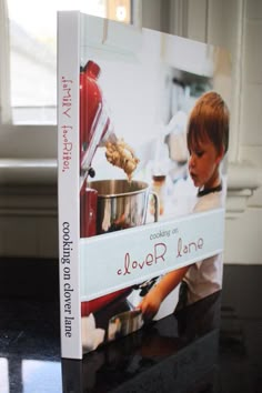 a cookbook sitting on top of a black counter