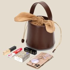 The Anais Bow Top Bucket Tote is the perfect combination of style and function. With its chic yet practical design, this bag makes a statement while keeping you organized. Don't just tote it – rock it! SIZE: W19cm X H13cm x D9cm / W7.48" x H5.12" x D3.54" Gender: WOMEN ItemType: Handbags & Shoulder Bags Main Material: PU, Faux Leather Lining Material: Polyester Shape: Bucket Interior: Interior Slot Pocket, Compartment Decoration: BOW Bucket Tote, Bow Top, Practical Design, Bag Making, Shoulder Bags, Promotion, Faux Leather, Shoulder Bag, Handbags