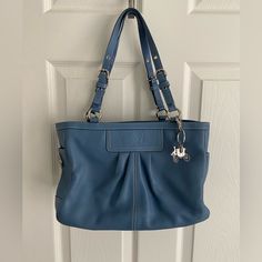 New With Tags. I Purchased Too Much Coach Over The Years And My Daughter Tells Me I Need To Pair Down:) Soft Blue Leather With Silver Hardware And Included Extra Coach Horse And Carriage Key Fob/Charm. Bag Is No Longer Made And Has Been Sitting In A Well Conditioned Room. Side Pockets To Hold Water Or Wipes. Interior Has A Zippered Compartment. Clean And Needs A Good Home Blue Satchel Shoulder Bag With Silver-tone Hardware, Formal Blue Shoulder Bag With Silver-tone Hardware, Coach Blue Shoulder Bag With Silver-tone Hardware, Blue Bags With Silver-tone Hardware For Daily Use, Classic Blue Bags With Silver-tone Hardware, Blue Shoulder Bag With Silver-tone Hardware, Elegant Blue Bag With Silver-tone Hardware, Elegant Blue Bags With Silver-tone Hardware, Blue Coach Bag With Branded Hardware