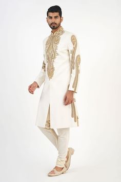 Ivory matka silk sherwani with dabka, beads and french knots hand embroidered motifs. Comes with churidar and a kurta. - Aza Fashions Elegant Off White Sherwani With Resham Embroidery, Traditional Off White Sherwani With Intricate Embroidery, Traditional Off-white Sherwani With Intricate Embroidery, Ceremonial Cream Nehru Jacket With Zari Work, Traditional Off White Raw Silk Bandhgala, Traditional Raw Silk Bandhgala In Off White, Elegant Churidar With Gold Embroidery For Eid, Cream Churidar With Intricate Embroidery, Unstitched Cream Sherwani With Intricate Embroidery