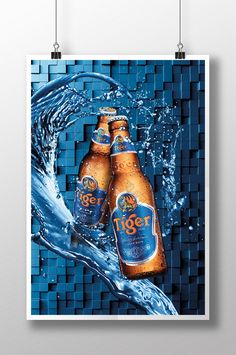 two beer bottles are in the water on a blue mosaic tile background, and one is being