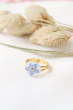 Gift Flower Ring With Pressed Flowers, Flower Shaped Ring With Pressed Flowers For Gift, Adjustable White Flower Promise Ring, Flower Shaped Pressed Flowers Rings, Flower Shaped Rings With Pressed Flowers As Gifts, Flower Shaped Rings With Pressed Flowers, Promise Flower Ring With Birth Flower, Adjustable Pressed Flowers Ring For Wedding, Delicate Birth Flower Ring Gift