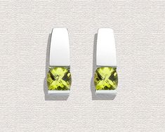 "Peridot Earrings - Argentium Silver - 2431 A contemporary, yet timeless design by award winning designer, David Worcester. Cast in Argentium 960 premium quality 100% recycled silver, these earrings are specially processed for tension setting. They measure 18mm x 7mm (3/4 x 1/4\") inches, and hold six millimeter antique square checkerboard cut Peridot. PLEASE LOOK AT THE MEASUREMENTS CAREFULLY. SOME PHOTOS HAVE BEEN ENLARGED TO SHOW DETAIL, WHILE OTHERS HAVE BEEN MINIMIZED TO FIT THE FRAME. ACTU Modern Green Earrings With Polished Finish, Modern Peridot Jewelry For Formal Occasions, Modern Green Earrings, Modern Green Peridot Jewelry, Elegant Lime Green Earrings For Formal Occasions, Elegant Lime Green Earrings For Formal Events, Modern White Gold Earrings With Tension Setting, Modern Green Earrings For Anniversary, Modern Silver Peridot Jewelry