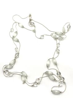 Gorgeous collectible white and clear beads necklace by Daisy Fuentes. White Crystal Beaded Chain Necklace, Elegant Clear Beaded Chain Necklace, White Multi-strand Costume Jewelry Necklace, White Beaded Crystal Necklaces, White Crystal Jewelry With Beaded Chain, Elegant White Glass Necklace, White Glass Beaded Necklaces, White Glass Round Bead Necklaces, White Crystal Round Bead Necklace