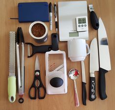 the kitchen utensils are arranged neatly on the table, ready to be used