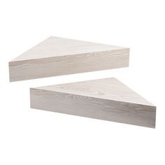 two pieces of wood sitting on top of each other