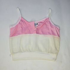 The left side does have some yellowing but this might come out after washing. I would also hang this to dry. USA MADE Brand new, originally deadstock Probably from the 70s 80s Fits best a xs or a small 80s Crop Top Outfit, 70s Crop Top Vintage, Retro Stretch Summer Tank Top, Retro Stretch Tank Top For Summer, White Sleeveless Retro Crop Top, Retro Pink Crop Top For Summer, 90s Style Camisole Tops For Summer, Retro White Crop Top For Summer, White Retro Crop Top For Summer