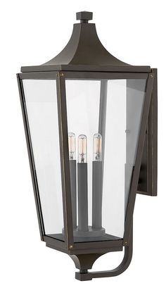 an outdoor light fixture with three lights on it