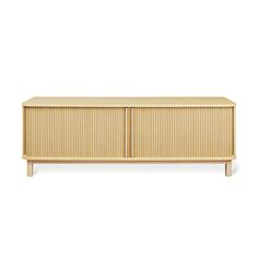 the sideboard is made from wood and has two doors