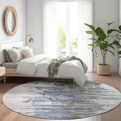 a bedroom with a round rug, bed and potted plant on the side table