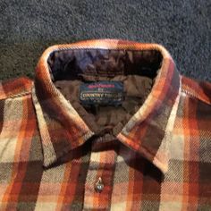 Vintage 1970s flannel shirt. Warm, earth tone, work shirt. Perfect for the urban Viking or lumberjack.Mens XL. Spring / Winter / Fall. By Country Touch Sportswear. Made in Taiwan R. O.C.Nice hunting / camping / outdoorsy, shirt.Perfect for hunting, camping, hiking.... walking the dog, shoveling snow, or working in the garage.For your favorite outdoorsman!CLEAN & READY TO WEARMEASUREMENTS & INFOShoulder: 21 inches (53. 3 CM)Chest: 54 inches (137CM)Sleeve: 25 inches (63. 5 CM)Brand: Country TouchLabel: SportswearLabelled size: XL Aprox Modern Size: XLColors: Brown, black, orange, tanMaterials: 100% AcrylicCirca: 1970sCountry of Origin: Taiwan R. O.C.Condition: Very good vintage condition with only light signs of wear, minor wear & pilling Outdoorsy Shirt, Shoveling Snow, 80s Denim, Turquoise Print, 80s Mens, Work Shirt, Denim Button Down, Plaid Flannel Shirt, Lumberjack