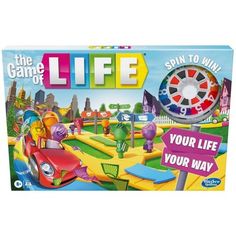 a board game with cars and people on the street in front of it, including a wheel