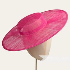 Boaters are all the rage, and this fuchsia pink sinamay fascinator version has us all in a twirl!  Made from 2 layers of stiffened sinamay, these boaters are ready to trim and have a petersham ribbon on it's inside edge. Simply add a comb or headband to secure to the head. Hat base measures: Width: 36.5cm (14.4 inches) Crown Width: Please note that the crown is on the larger side, measures 16.5cm (6.5 inches) wide.  Crown Height: 4.5cm (1.7 inches) Please note our latest batch of boaters have be