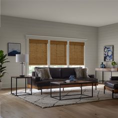 a living room filled with furniture and windows