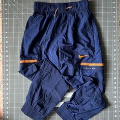 New, Never Worn Or Washed. Training Pants. Zipper Cargo Pockets To Keep Cash Safe! Blue Bottoms With Elastic Waistband For Outdoor Activities, Navy Athleisure Bottoms For Outdoor, Blue Cotton Bottoms For Outdoor Activities, Nike Cotton Cargo Pants For Sports, Blue Cargo Bottoms For Outdoor Activities, Sporty Navy Bottoms For Outdoor Activities, Sporty Navy Bottoms For Outdoor, Blue Pants With Elastic Waistband For Outdoor Activities, Blue Cotton Pants For Outdoor Activities