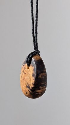 This is a handcrafted birch wood pendant made from locally recycled wood. This pendant features a beautiful and unique pattern caused by the natural decay of birch wood, as well as a hand sculpted design to complement it. The result is a timeless, breathtaking and organic piece of jewelry that suits women, men and children for almost any occasion or simply everyday life. I make these using only naturally fallen wood that I find on walks through my local forests - occasionally in the company of m Holistic Wooden Beads Necklace As A Gift, Holistic Wooden Beads Necklace For Gift, Holistic Style Wooden Beads Necklace For Gifts, Holistic Style Necklace With Wooden Beads, Holistic Style Necklace With Wooden Beads For Gifts, Adjustable Artisan Natural Wood Necklace, Artisan Necklaces In Natural Wood As Gift, Artisan Necklace In Natural Wood As A Gift, Engraved Natural Wood Necklace As Gift