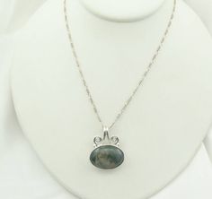 "Gorgeous green moss agate cabochon in a vintage sterling silver pendant. Marked \"925\". 18\" inch sterling silver chain included! A wonderful addition to your personal jewelry collection. FREE Domestic Shipping! Details: Sterling Silver: (as shown in photo) Moss Agate: cabochon Approximate Pendant Dimensions: 1 1/4 inch x 1 inch Chain Length: 18 inches Total Weight: 12.7 grams FREE Domestic Shipping by USPS Priority Mail Signature Confirmation and includes insurance. If the item is to be shipp Nickel-free Moss Agate Silver Jewelry, Nickel-free Silver Moss Agate Jewelry, Silver Moss Agate Jewelry With Cabochon, Silver Moss Agate Cabochon Jewelry, Moss Agate Cabochon Pendant Jewelry, Elegant Moss Agate Cabochon Jewelry, Green Oval Moss Agate Jewelry, Green Moss Agate Oval Jewelry, Moss Agate Cabochon Pendant Necklace