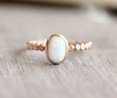 8x6mm simulated opal stone set onto a 14k rose gold filled bead band. Also available with a turquoise, rainbow moonstone, lab ruby, or a pink opal. All orders ship in a gift box. If you are ordering multiple items and want them boxed separately, please let me know in the notes at checkout. I ship via USPS. Please review the estimated delivery date and processing times. Processing times vary based on how busy my shop is at the time. **Stacking Ring Sizing - When you are stacking multiple rings yo Oval Opal Ring, Gold Opal Ring, Rose Gold Opal Ring, Birthstone Stacking Rings, Multiple Rings, Mom Ring, Opal Ring Gold, Gold Gemstone Ring, Ring Rose Gold