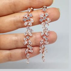 ❤️Best seller These diamond look, long and dainty bridal earrings are made with clear, round and marquise cut Cubic Zirconia chandelier pendants in Rose gold plated brass settings. The earrings dangle from high quality silver plated ear posts with clear CZ studs. The earrings have delicate sparkle and shine and would be a perfect accessory to add glamor and elegance to your bridal style! (High quality plating, Anti tarnish, Nickel free). * These chandelier earrings measure about 60mm / almost 2. Statement Earrings Wedding Rose Gold, Luxury Rose Gold Round Bridal Earrings, Luxury Rose Gold Jewelry With Matching Earrings, Cheap Gold Bridal Earrings For Festive Occasion, Luxury Rose Gold Diamond Wedding Earrings, Cheap Rose Gold Dangle Earrings, Long Rose Gold Earrings, Luxury Rose Gold Jewelry For Reception, Cheap Tarnish Resistant Rose Gold Earrings