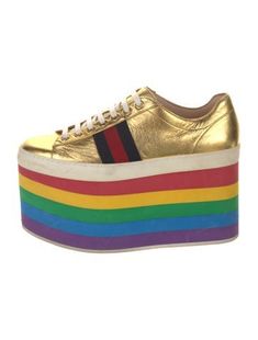 Gucci Leather Low Top Wedge SneakersGold & MetallicSylvie Web AccentRound-ToesPlatformLace-Up Closure at UppersDesigner Fit: Sneakers by Gucci typically run a half size large.Unfortunately, due to restrictions, this item may not be eligible for shipping in all areas. Sneakers Gucci, Plateau Sneaker, Rainbow Sneakers, Flatform Sneakers, Rainbow Shoes, Gucci Sneakers, Red Sneakers, Gucci Leather, Platform Sneaker