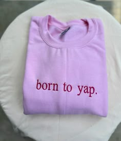 Born to Yap Sweatshirt, Embroidered Sweatshirt, Funny Statement Sweatshirt, Cozy Sweatshirt, Stylish Apparel, Dog Lover Gift Introducing our "Born to Yap" Embroidered Sweatshirt, the perfect blend of comfort, style, and personality. Whether you're a proud dog lover or just someone who loves to chat, this sweatshirt is a must-have addition to your wardrobe.  High-Quality Embroidery - **Intricate Design Beautifully embroidered with the phrase "Born to Yap." - **Durable Threads Ensures long-lasting Simple Crewneck Design, Born To Yap, Custom Embroidered Cotton Tops For Streetwear, Trendy Custom Embroidery Tops For Streetwear, Pink Custom Embroidery Sweatshirt For Streetwear, Cotton Crew Top With Embroidered Text, Pink T-shirt With Embroidered Graphics For Streetwear, Spring Streetwear Tops With Custom Embroidery, Purple Cotton Crew Neck Top