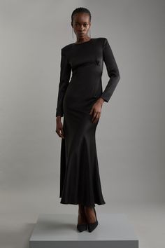 Elevate Your Occasion Wear Wardrobe With Our Elegant Midaxi Dress, With A Fitted Bodice Which Flows Into A Straight Skirt, And A Sleek, Slinky Design Perfect For Re-Wearing To Any Occasion. Style It With Strappy Heels For An Occasion Look That Is Guaranteed To Turn Heads Wherever You Step. Satin Back Crepe Long Sleeved Column Woven Midaxi Dress High Quality, Slinky Satin Backed Crepe Fabric Figure Hugging Fit Bodice Straight Hanging Skirt Long Sleeves High Neckline Keyhole Accent In Back Button Satin Long Sleeve Dress, Wedding Pants, Transitional Fashion, Winter Wedding Guest Dress, Summer Bridesmaid Dresses, Spring Wedding Guest Dress, Fall Wedding Guest Dress, Midaxi Dress, Satin Long Sleeve