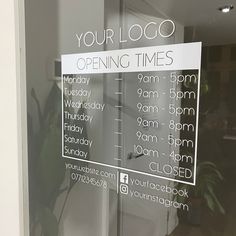 a sign is posted on the glass door of a closed storefront with hours and hours