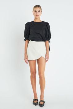 Our High Waist Overlay Skort is the perfect combo of flirtatious and functional. Featuring an overlay construction two back fake welt pockets and back-layered skirt this skort will be your new go-to. The side seam zip closure is hidden in ensuring a flattering fit. Look fabulous and feel comfortable while wearing our High Waist Overlay Skort. Crafted with style and quality this garment is sure to be a wardrobe staple. High waist Overlay skort Back layered skirt Back fake welt pockets Side hidden High Waist Lined Skort, Relaxed Fit, Trendy Black High-waisted Skort, Chic Black High-waisted Skort, High-rise Fitted Black Skort, Nylon Skort With Built-in Shorts, Layered Skirt, Welt Pocket, Denim Pants, Wardrobe Staples