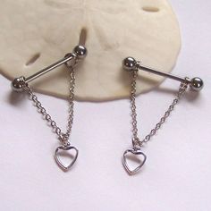 two heart shaped danglings attached to a chain