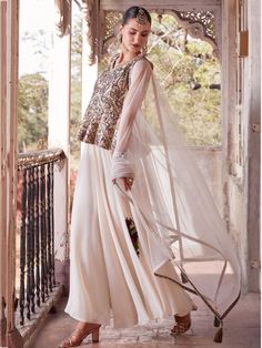 This beautifully crafted set includes an off-white color satin peplum top with intricate print work, a georgette palazzo in a similar off-white shade, and a net dupatta with designer lace work to complete the look. The set is fully stitched and available in M & XL sizes, making it convenient for all body types.
The off-white peplum top palazzo set offers a myriad of benefits to the wearer. The soft georgette fabric ensures comfort and breathability, while the elegant design and intricate det Fitted White Organza Palazzo Set, White Fitted Organza Palazzo Set, Cream Anarkali Gown In Georgette, Cream Anarkali Georgette Gown, Off White Silk Sets With Sheer Dupatta, White Organza Palazzo Set For Party, Cream Floor-length Sets With Sheer Dupatta, Festive Cream Georgette Gown, Cream Resham Embroidered Georgette Gown