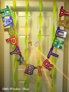 a happy birthday banner hanging from the front door